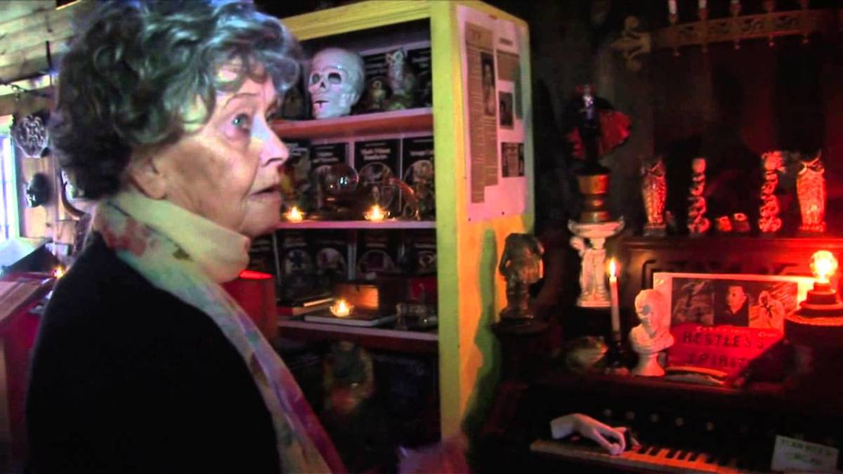 lorrainewarren-in-front-of-piano-1200x675